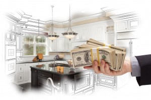 Hand Holding Cash Over Kitchen Design Drawing and Photo