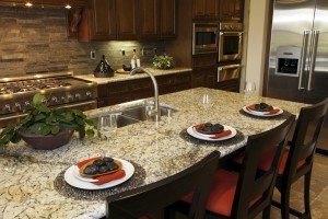 Luxurious kitchen with granite counter tops. 