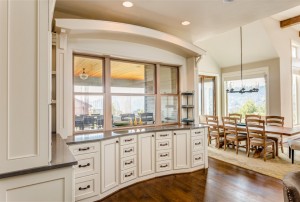 Hardwood floors and beautiful cabinetry highlight this stunning kitchen/dinign area